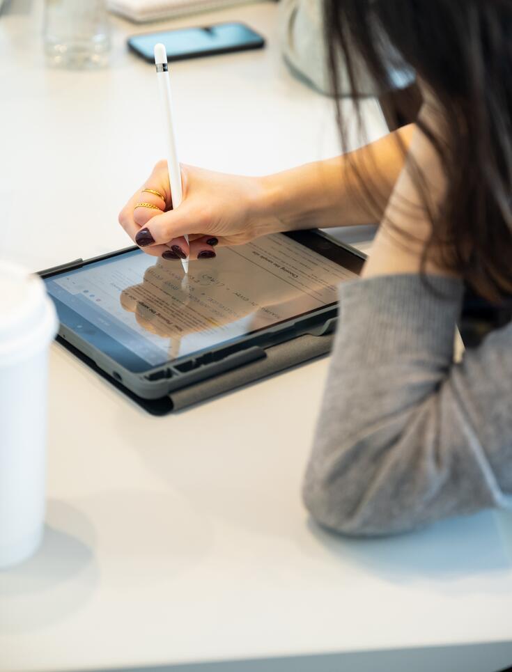 Student takes notes on a tablet